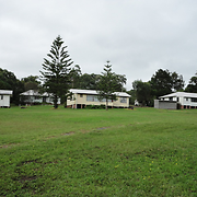 View of four of the five cottages from the west. In the foreground is the site of the original cottage dormitories